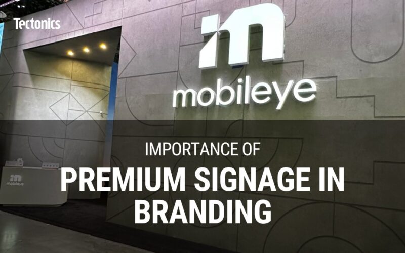 a fabric wall with large 3D letters mounted to it and text that reads "importance of premium signage in branding"