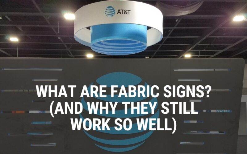 Text over a tradeshow display with a fabric sign that says "What are fabric signs?"