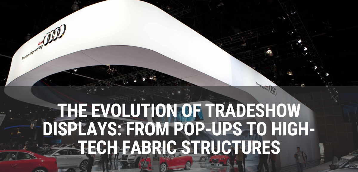 a large tradeshow display with the words The Evolution of Tradeshow Displays: From Pop-Ups to High-Tech Fabric Structures